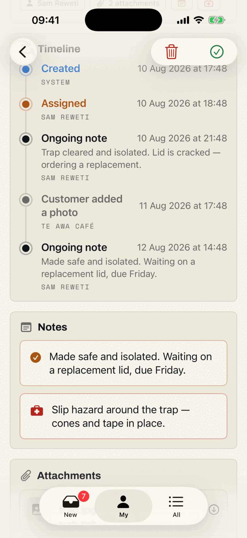 The timeline card in the app: created, assigned, an ongoing note from the technician, a photo the customer added from the portal, and a second note, each with a date, a time and a name.